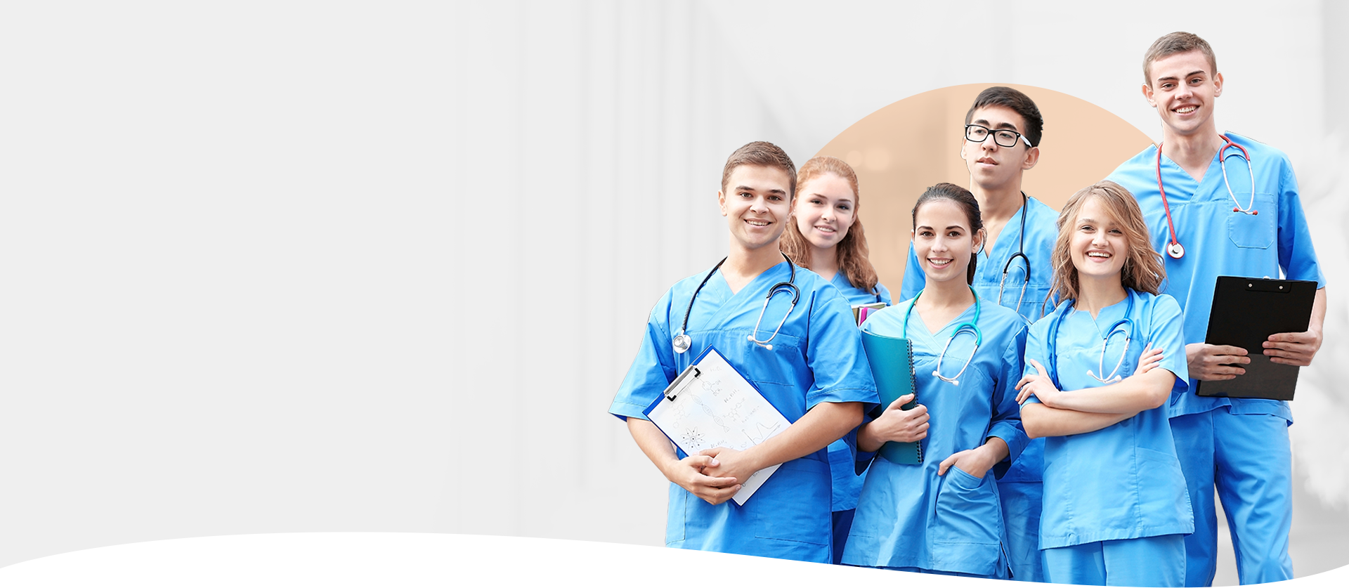 Medical students wearing scrubs collaborate as a team, highlighting Academia Group's training resources.