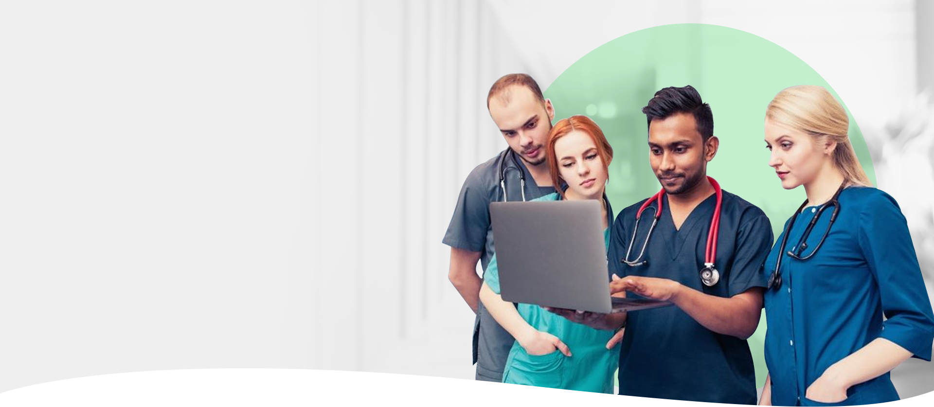 Healthcare workers collaborate on a laptop, showcasing valuable training resources for RTO compliance.