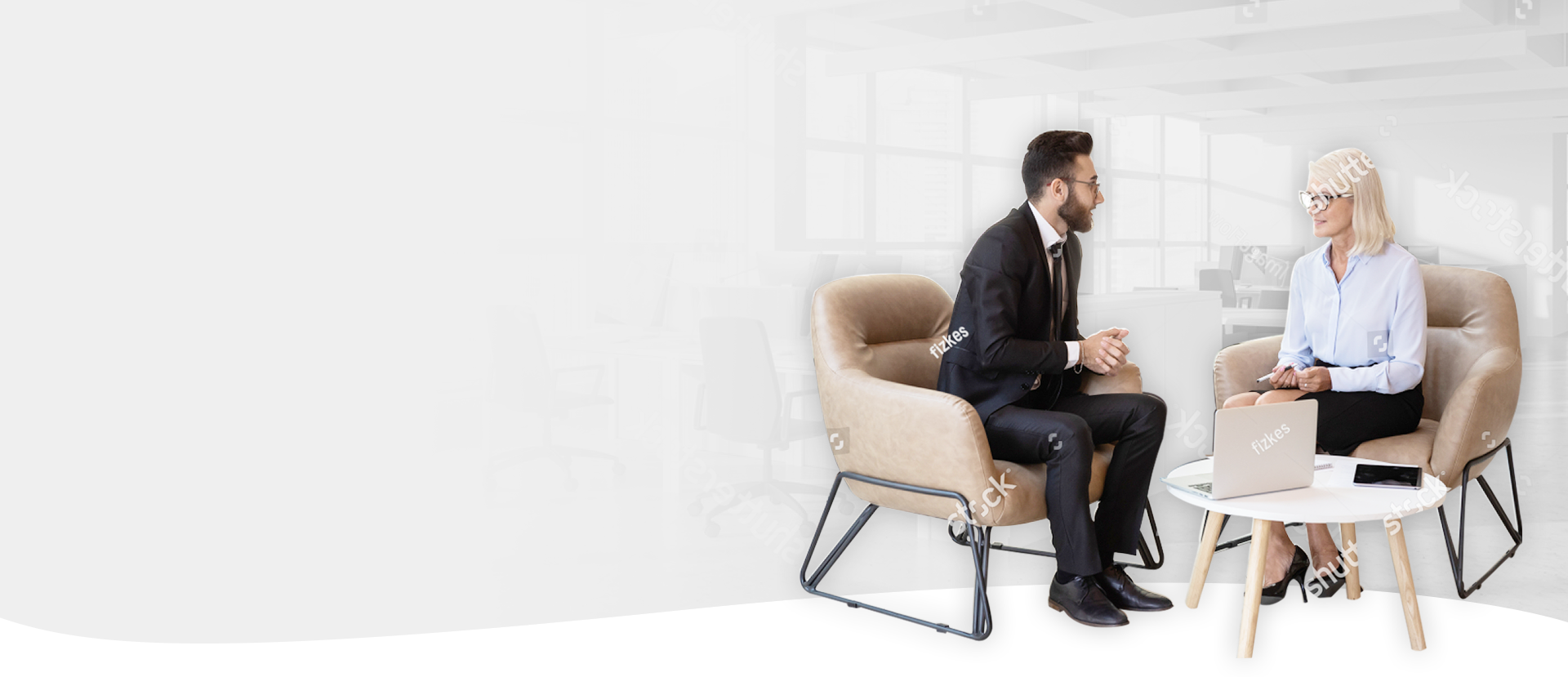 Business professionals discuss strategy in a modern office, supporting RTO compliance.